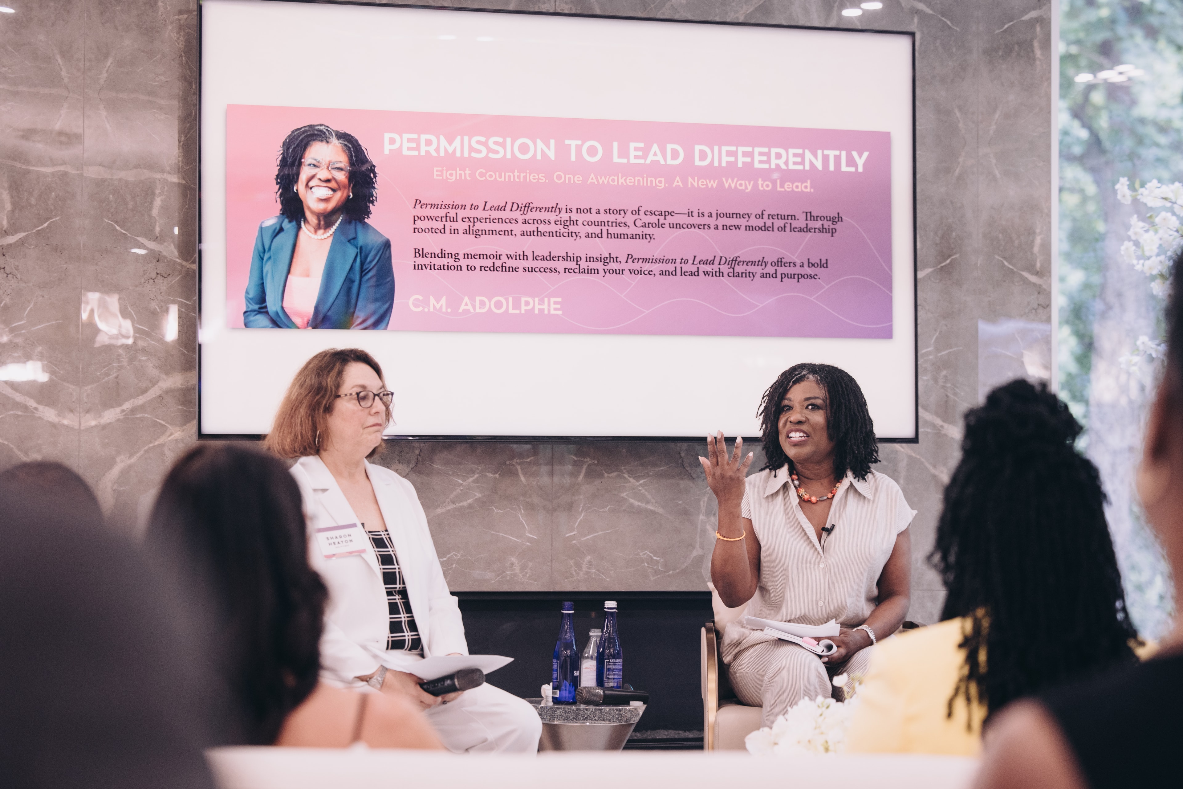 Engaged audience at a Carole Adolphe speaking event